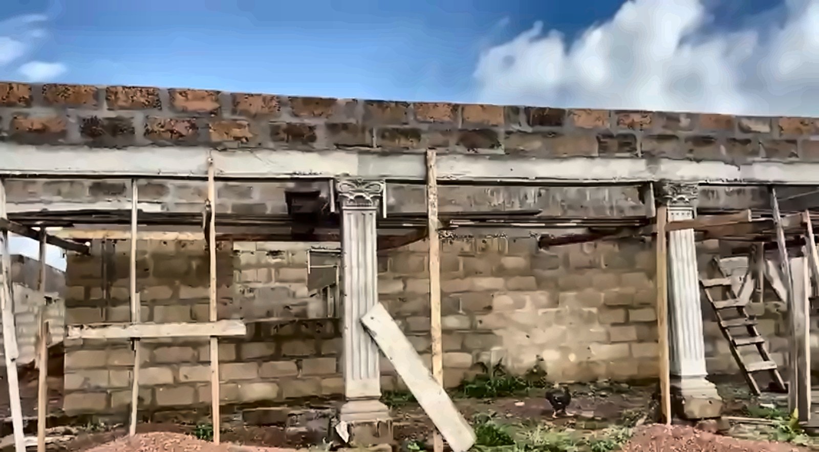 Columns and scaffolding along the front of the building