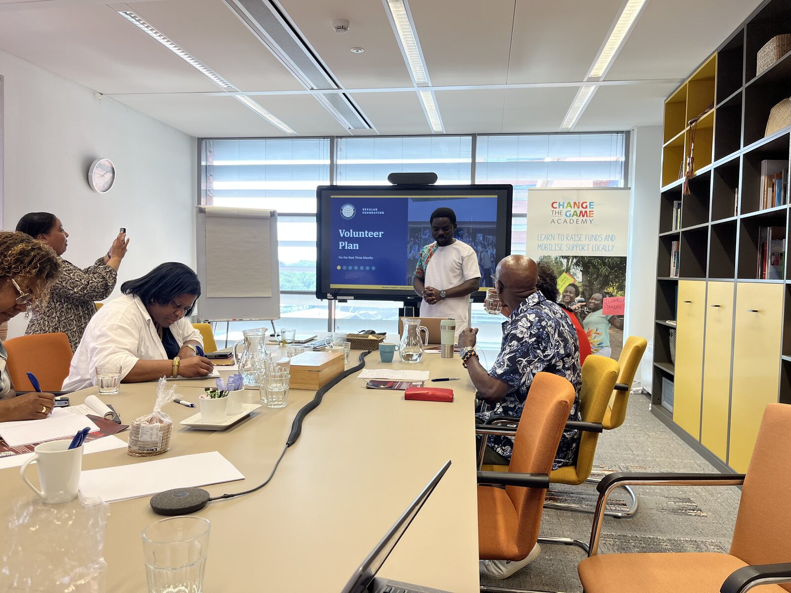 Elisha Njomaba presenting Nevalak Foundation's Volunteer Plan